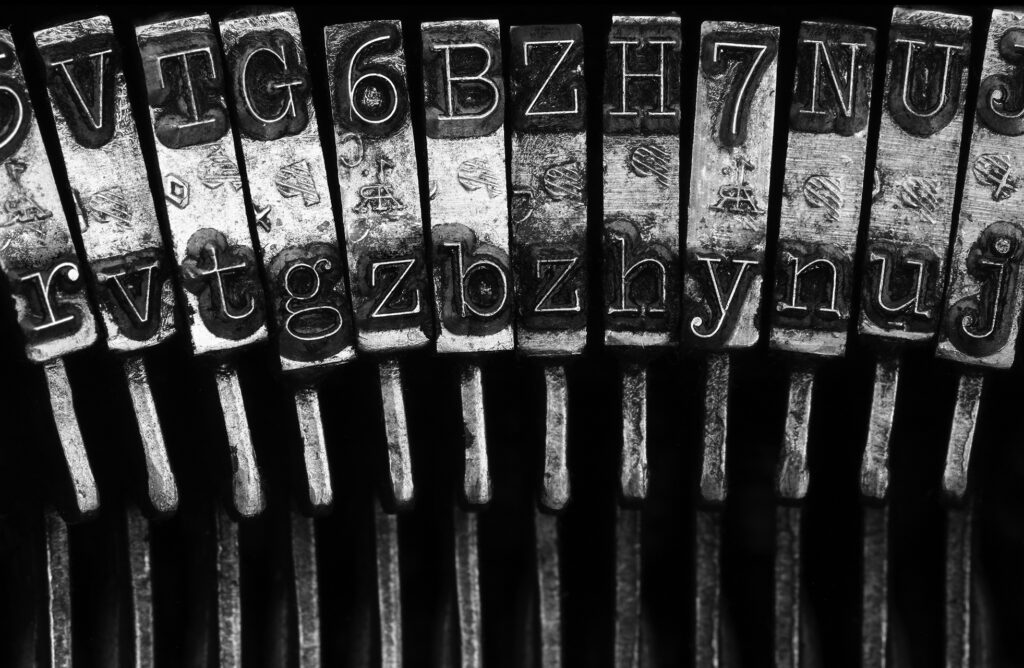 Close up photo of typewriter keys for the blog: Do you make typos, miss punctuation or make grammar mistakes? Learn how that affects your brand in this article.