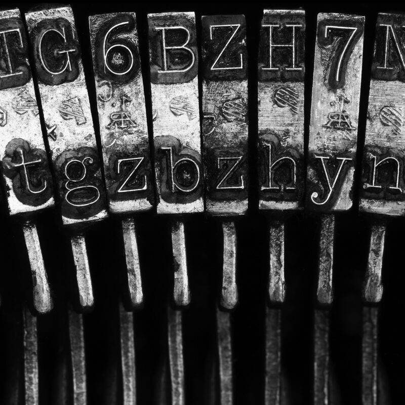 Close up photo of typewriter keys for the blog: Do you make typos, miss punctuation or make grammar mistakes? Learn how that affects your brand in this article.